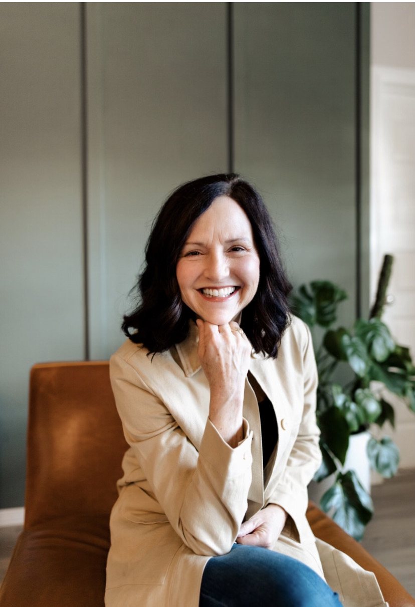Suzanne Barker, Registered Dietitian Nutritionist, smiling in a warm, natural-light portrait.